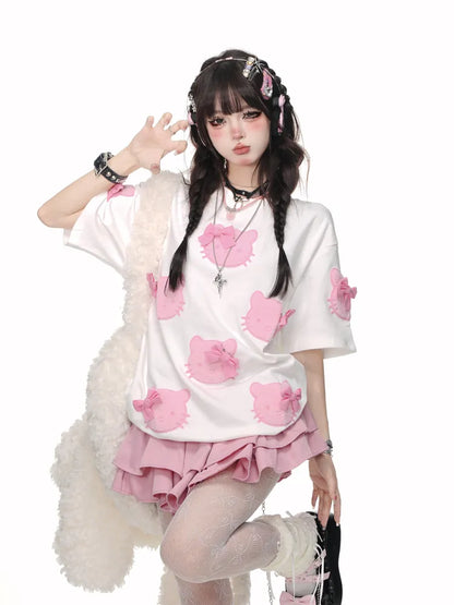 白/ピンクの蝶結びTシャツ柄 かわいい子猫