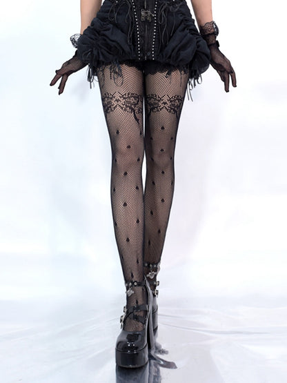 ブラック/ホワイトの蝶結びと水玉模様の網タイツ