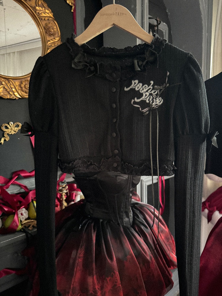 Schwarzes, langärmliges Strickoberteil mit Stickerei