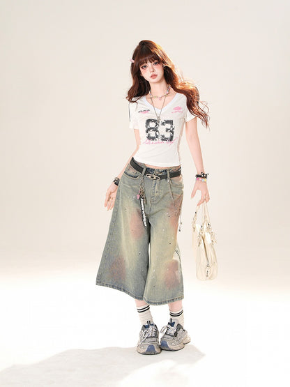 ブルーのローライズ ダメージ加工 スパンコールディテール ストレートレッグジーンズ