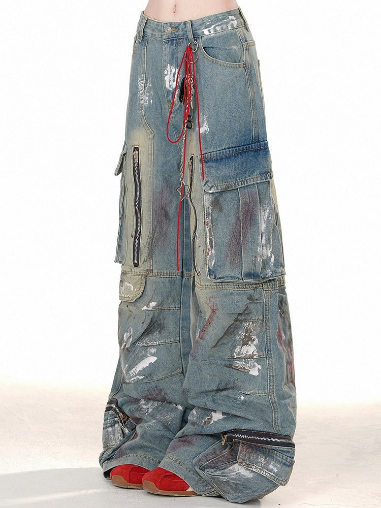 ブルーのワイドレッグカットデザイン、ジッパー付きカーゴジーンズ、スプレーペイントプリント