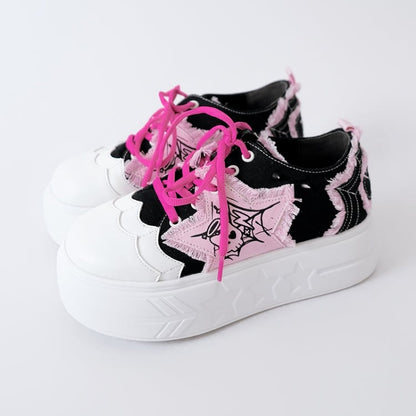 Schwarze und rosa Plateau-Sneaker mit Stern-Applikation