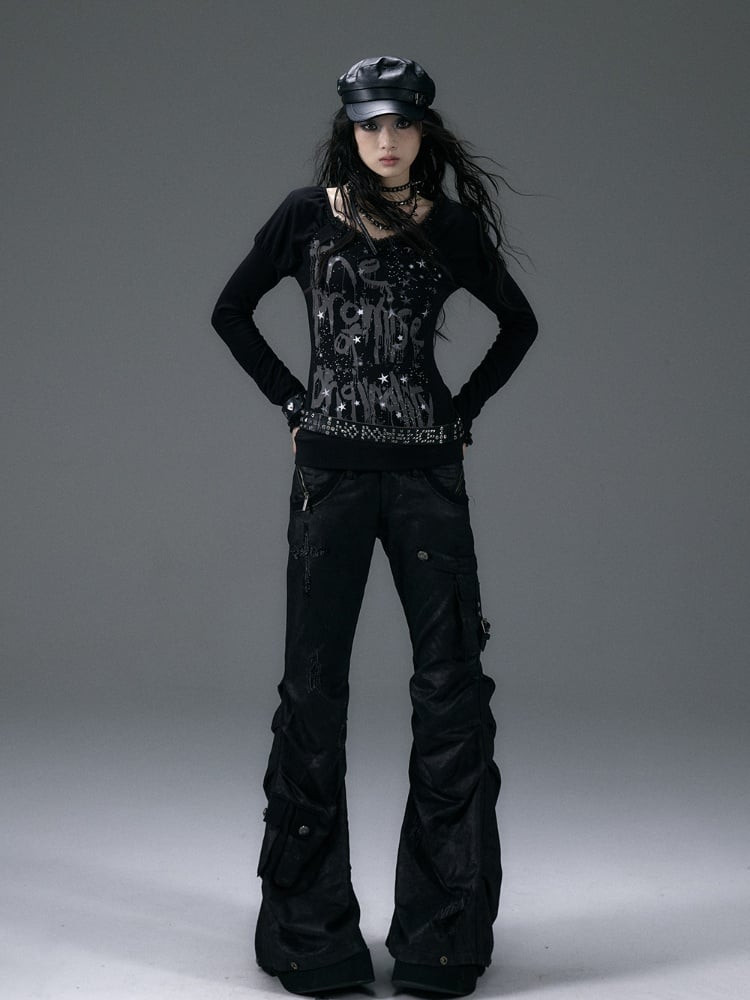 Schwarzes Top mit V-Ausschnitt und schimmernder Sternspitze