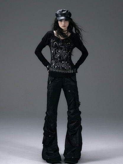 Schwarzes Top mit V-Ausschnitt und schimmernder Sternspitze