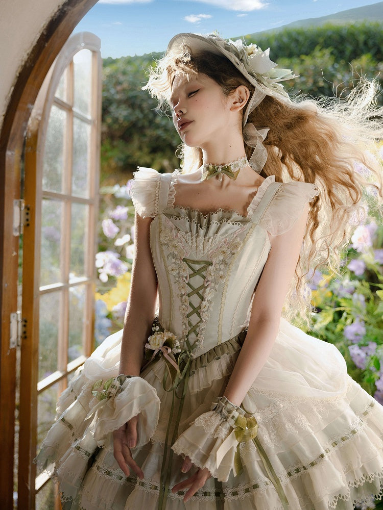 Beige und grüne Handmanschetten mit Schleife