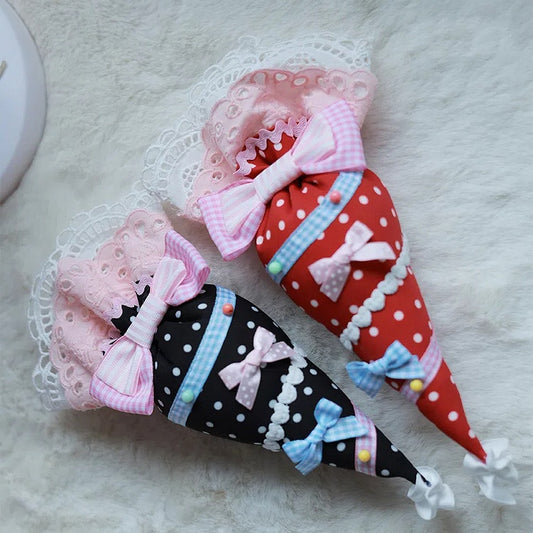 ペストリー / 黒バッグ 黄色 赤 ブローチ