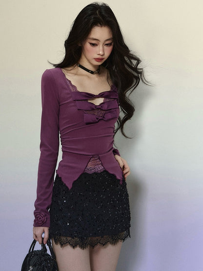 Lilafarbenes Oberteil mit Schleifenakzenten und Spitzenbesatz, V-Ausschnitt und langen Ärmeln