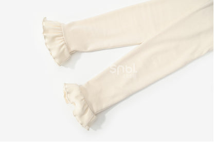 Aprikosenfarbenes, langärmliges Oberteil mit Spitzenbesatz und Schleifendetails