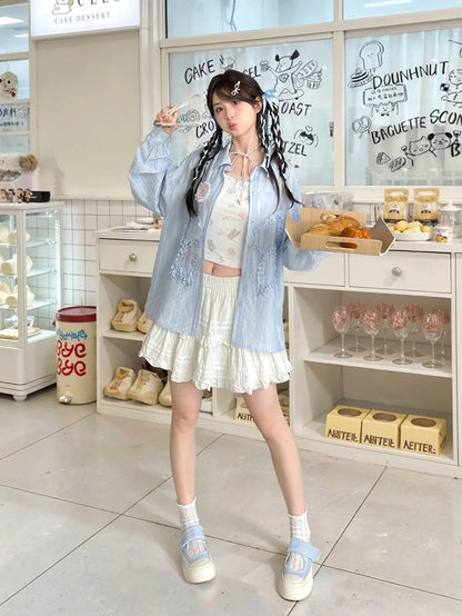 セミシースルーのフリル付き蝶結びアップリケ付きブルーサンプロテクションシャツ