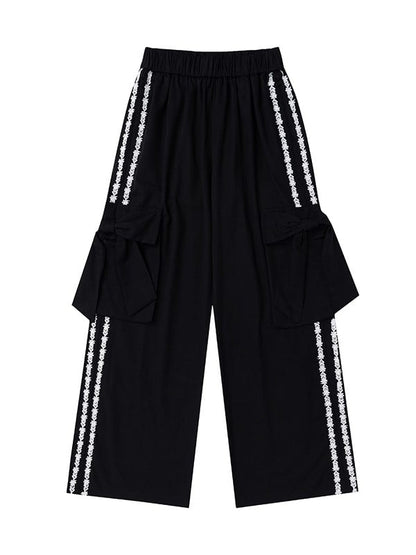 Hose mit floralen Schleifendetails und geradem Bein mit apricot/schwarzen Streifen und