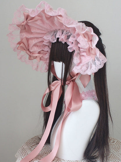 ピンクの蝶結びディテール、レーストリムのボンネット