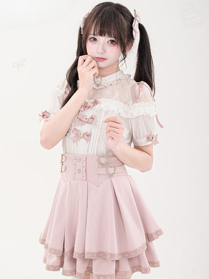 蝶結びのショート丈ジライラインストーンシャツプリーツピンクのディテール袖装飾ケイハート