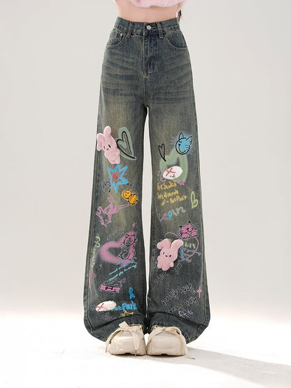 Jeans mit weitem Bein, buntem Graffiti und abnehmbarem rosa Plüschhasen in Blau