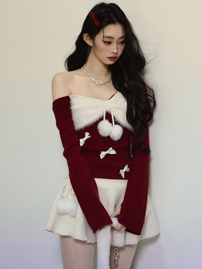 Strickoberteil mit asymmetrischem Ausschnitt und roter Schleife