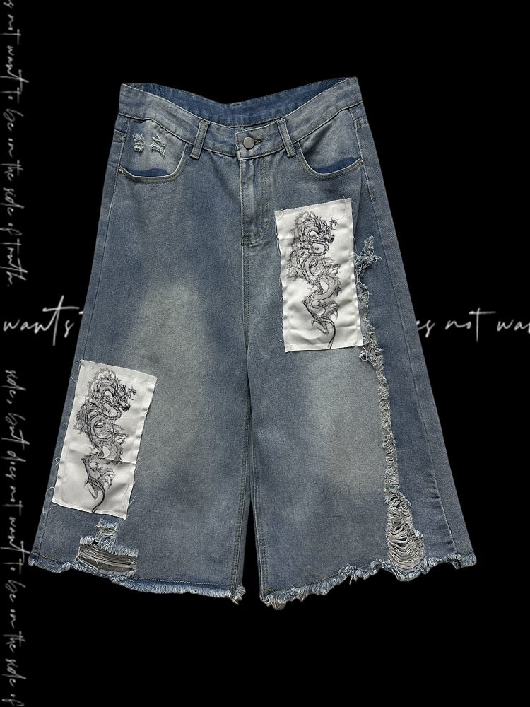 ブルーのワイドレッグジーンズ、ドラゴンのアップリケ、切りっぱなしの裾、ダメージ加工の穴、ライト