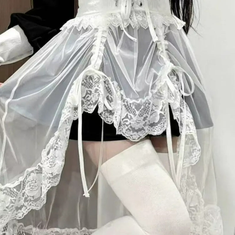 White sheer lace waist accessory styled over dark bottoms