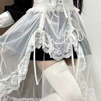White sheer lace waist accessory styled over dark bottoms