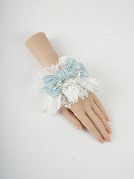 Blaue Handgelenkmanschetten mit großer Schleife, Rüschenspitze und Perlenkette
