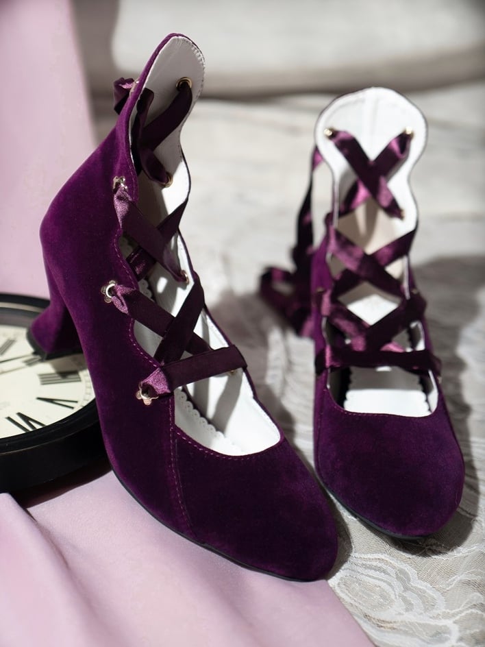 Purple velvet pointed toe lace-up heels pair
