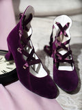 Purple velvet pointed toe lace-up heels pair