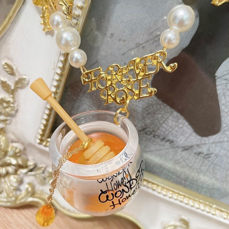 Gelb verzierter Perlen-Honigtopf-Anhänger und Halskette mit Schleife