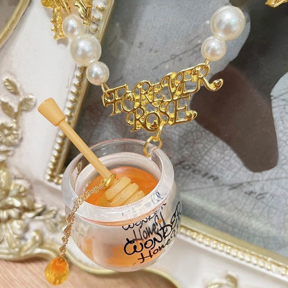 Gelb verzierter Perlen-Honigtopf-Anhänger und Halskette mit Schleife