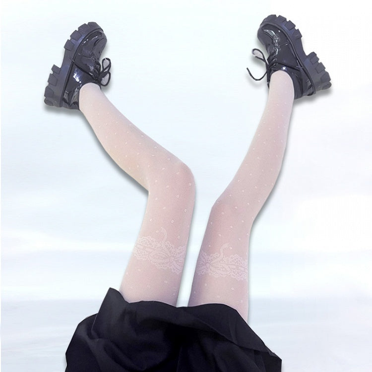 ブラック/ホワイトの蝶結びと水玉模様の網タイツ