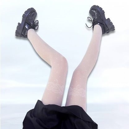 ブラック/ホワイトの蝶結びと水玉模様の網タイツ