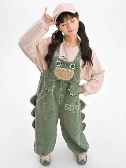 かわいい恐竜の緑のぬいぐるみオーバーオール