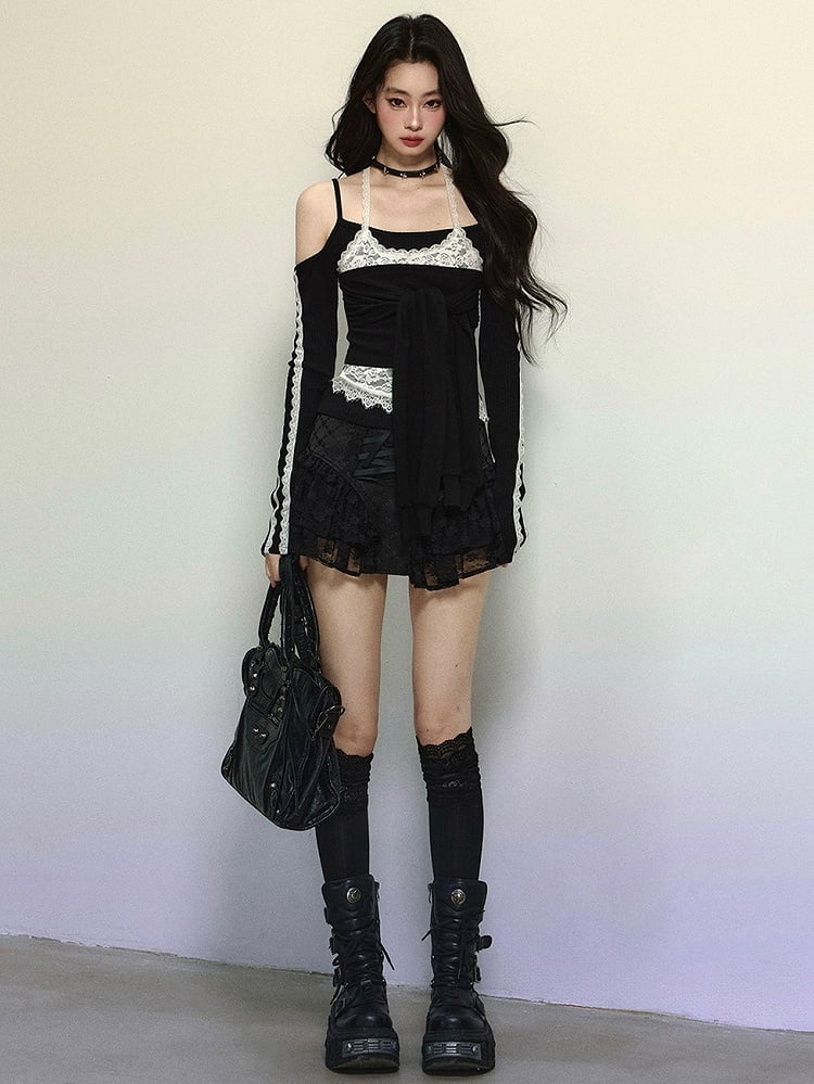 Schwarzes Neckholder-Oberteil mit langen Ärmeln und auffälligem Bindeakzent