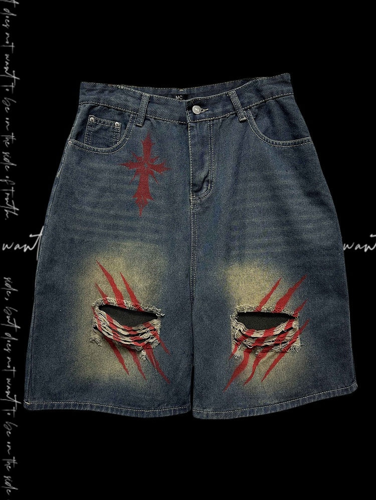 Blaue Denim-Shorts mit weitem Bein und verblassten Löchern im Scratch-Waschung-Look