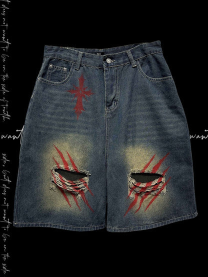 Blaue Denim-Shorts mit weitem Bein und verblassten Löchern im Scratch-Waschung-Look