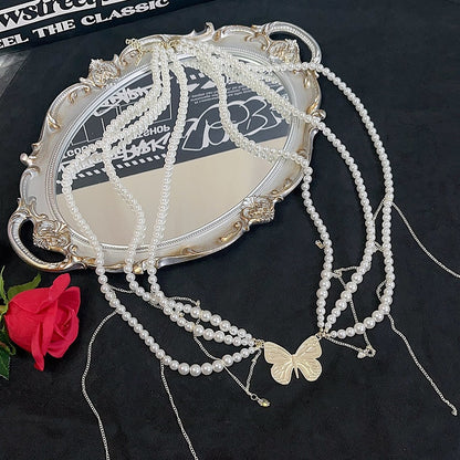 蝶の白いウエストチェーン、ビーズで飾られた