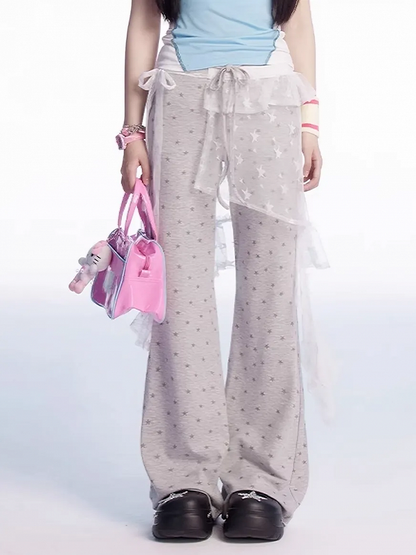 グレーのドローストリングウエストオールオーバーパンツ、スタープリントフレアカジュアル