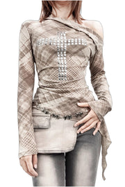 Angled neckline and cross motif on tartan top