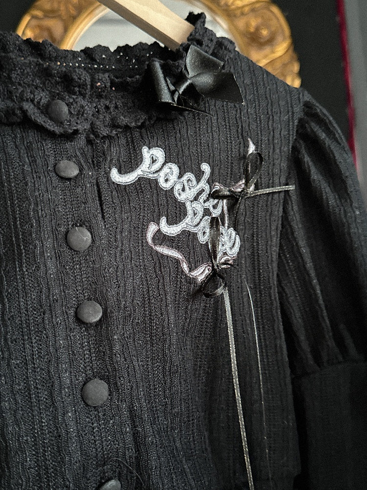 Schwarzes, langärmliges Strickoberteil mit Stickerei