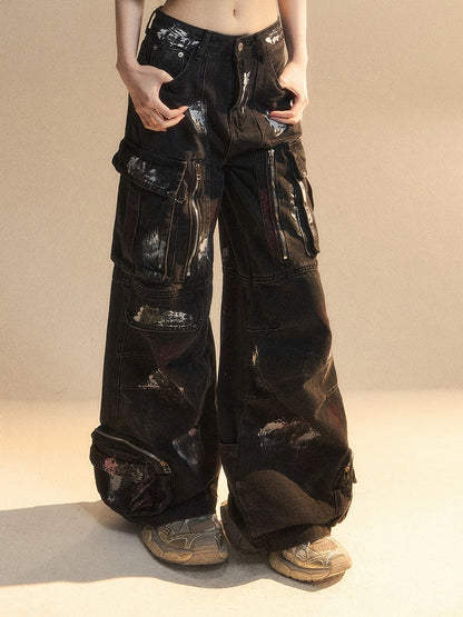 Reißverschlussdetails, Spray Black Pockets, Cargo-Print, Distressed Paint, Wide-Leg-Jeans
