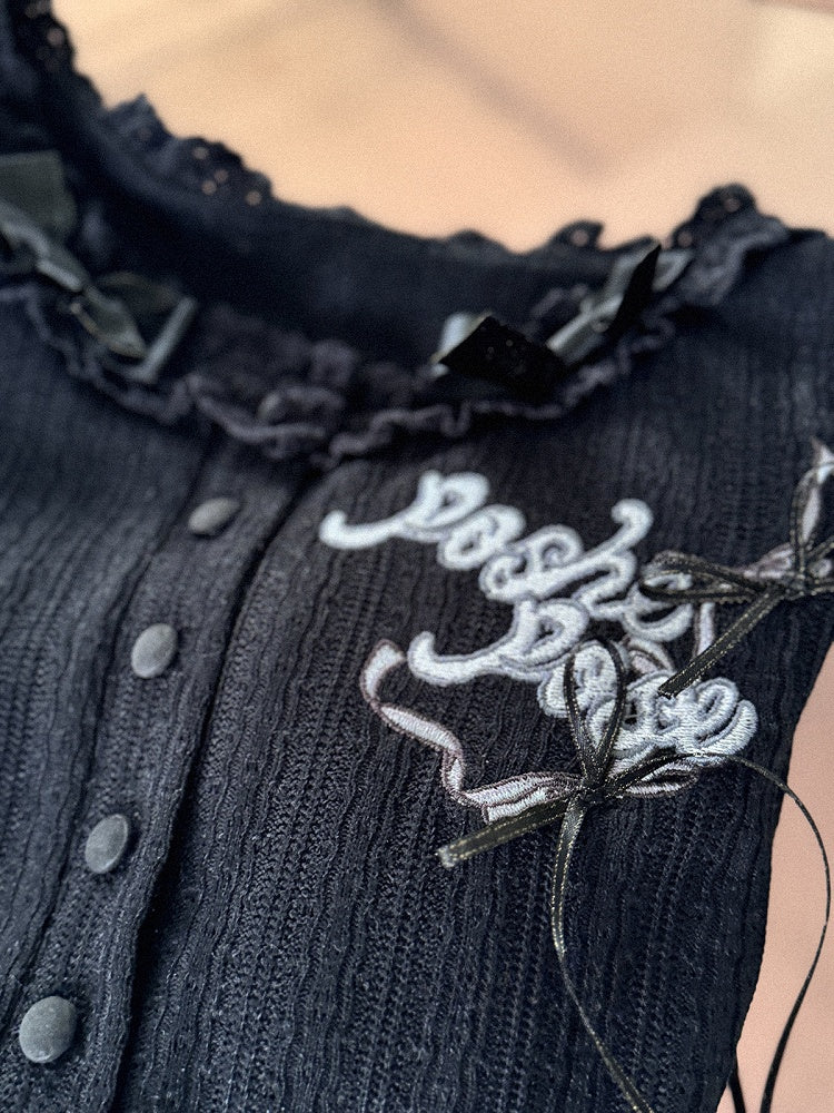 Schwarzes, langärmliges Strickoberteil mit Stickerei