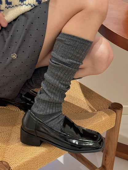 Gestrickte Beinwärmer in Weiß/Aprikose