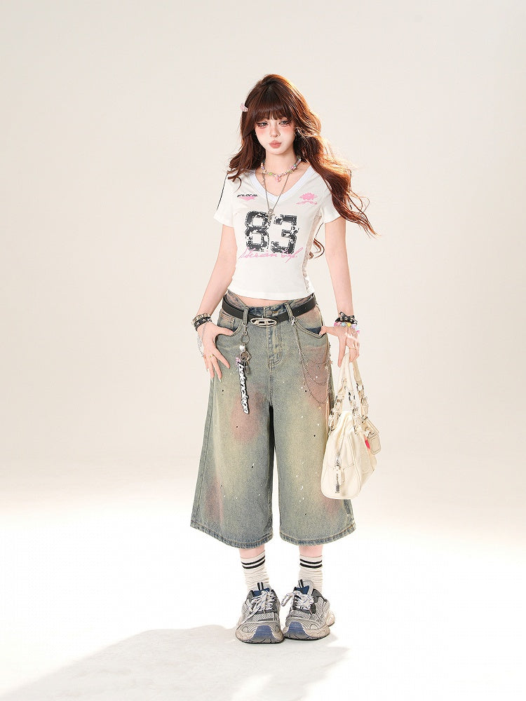 ブルーのローライズ ダメージ加工 スパンコールディテール ストレートレッグジーンズ