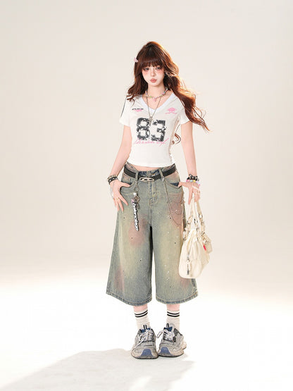 ブルーのローライズ ダメージ加工 スパンコールディテール ストレートレッグジーンズ