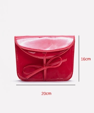 Elegant Black Crossbody Phone Pouch With Glossy Finish And Bow Accent