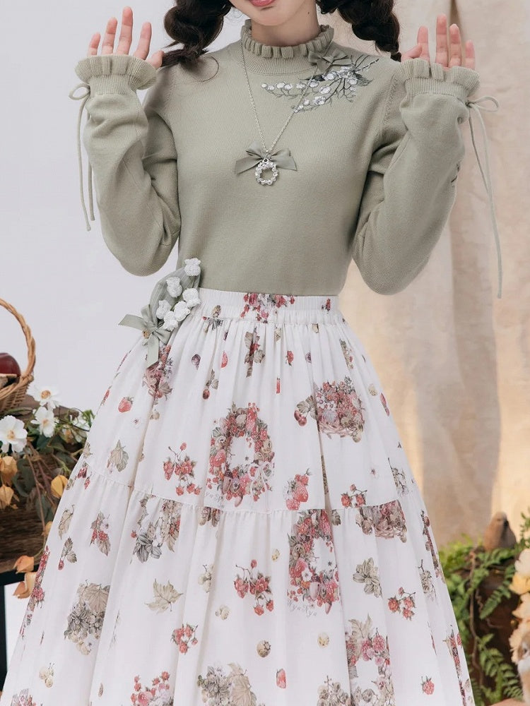 秋らしいレースアップのカフスニットのリリーバレーグリーンの刺繍トップス