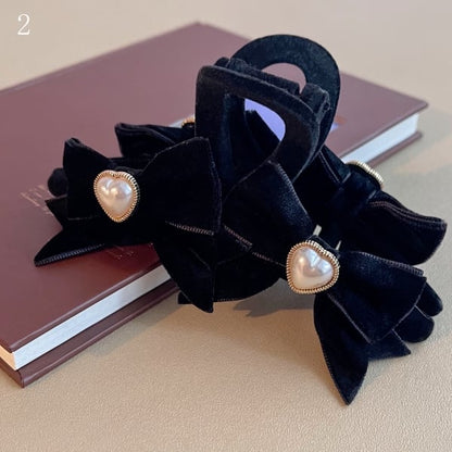 ビーズの蝶結びの黒い爪クリップ装飾