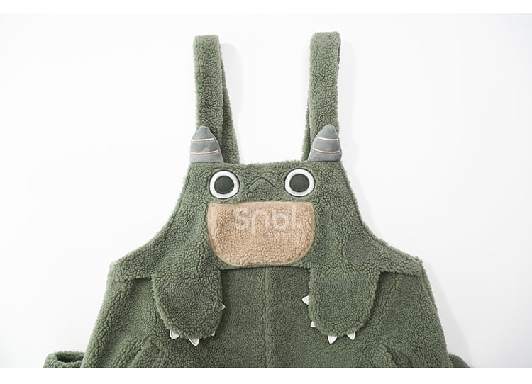 かわいい恐竜の緑のぬいぐるみオーバーオール