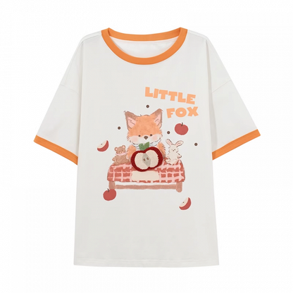 白い漫画のキツネのプリントのロングバージョンTシャツ、リンゴのブローチ付き