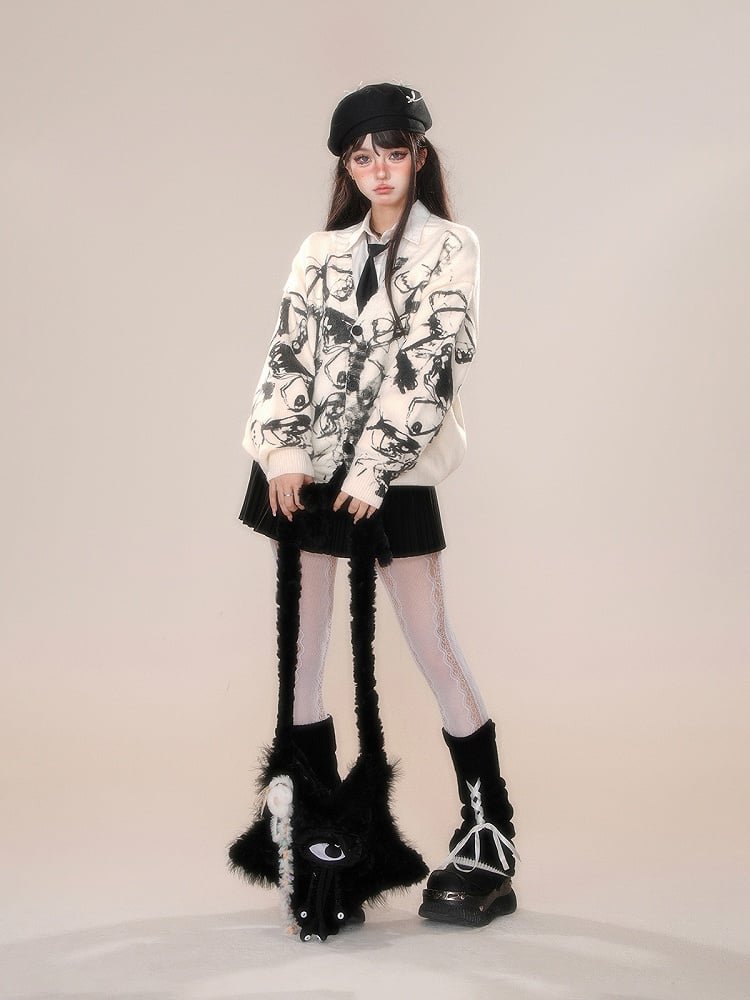 取り外し可能なポンポンとリボン飾りが付いたプリーツスカート