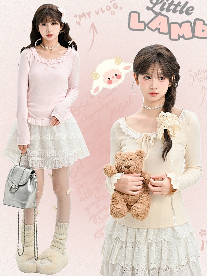 Aprikosenfarbenes, langärmliges Oberteil mit Spitzenbesatz und Schleifendetails