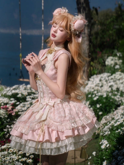 ウエストに大きなリボンが付いた、桜ピンクのコルセットウエストチーロリータドレス
