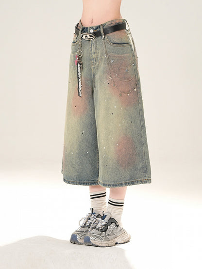 ブルーのローライズ ダメージ加工 スパンコールディテール ストレートレッグジーンズ